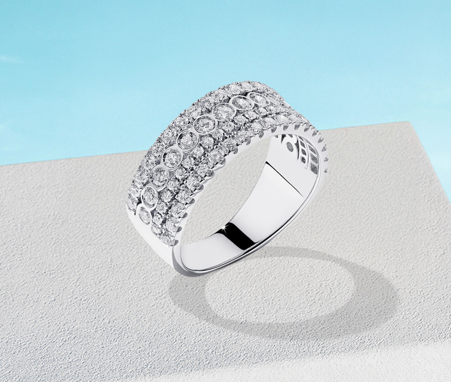 Birks splash white gold ring on a sky background.